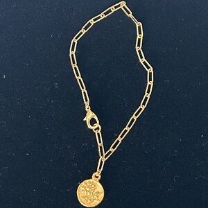 Gold tone paper clip chain bracelet with flower charm, 8”